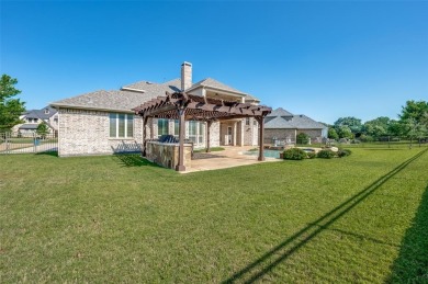 Nestled on a premier GOLF COURSE lot overlooking the tee box of on Lantana Golf Club in Texas - for sale on GolfHomes.com, golf home, golf lot