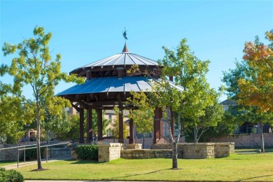 Nestled on a premier GOLF COURSE lot overlooking the tee box of on Lantana Golf Club in Texas - for sale on GolfHomes.com, golf home, golf lot