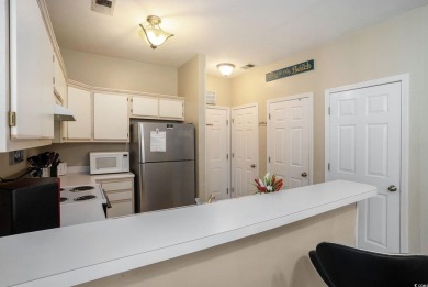 This bright 2 bedroom, 2 bath end unit in the desirable River on River Oaks Golf Plantation  in South Carolina - for sale on GolfHomes.com, golf home, golf lot