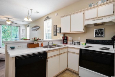 This bright 2 bedroom, 2 bath end unit in the desirable River on River Oaks Golf Plantation  in South Carolina - for sale on GolfHomes.com, golf home, golf lot