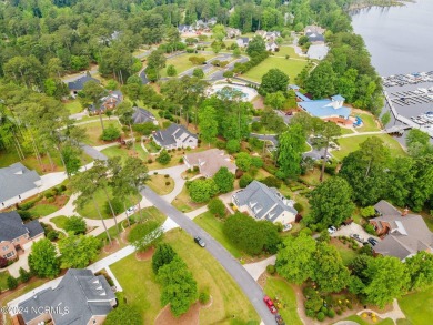 Discover this stunning all-brick home in the prestigious Cypress on Cypress Landing Golf Club in North Carolina - for sale on GolfHomes.com, golf home, golf lot