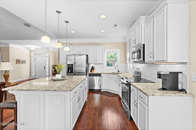 The all-brick former model home in the Regency Lakes section of on Members Club At St. James Plantation in North Carolina - for sale on GolfHomes.com, golf home, golf lot