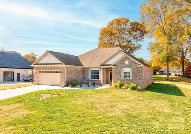 Welcome to 128 Harbourtown Drive - Woodbridge Subdivision. This on Woodbridge Golf Links in North Carolina - for sale on GolfHomes.com, golf home, golf lot