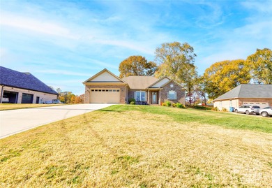 Welcome to 128 Harbourtown Drive - Woodbridge Subdivision. This on Woodbridge Golf Links in North Carolina - for sale on GolfHomes.com, golf home, golf lot