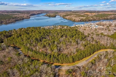 Located in the prestigious gated community of Heron Bay, this on Old North State Club at Uwharrie Point Golf community in North Carolina - for sale on GolfHomes.com, golf home, golf lot