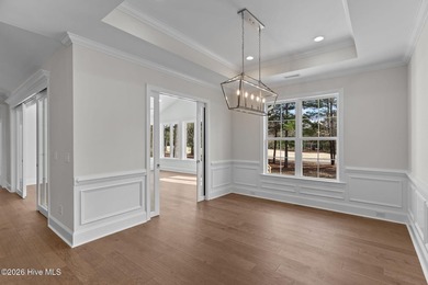 Settle into the ease of coastal living with this thoughtfully on River Landing Golf Course in North Carolina - for sale on GolfHomes.com, golf home, golf lot