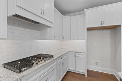 Settle into the ease of coastal living with this thoughtfully on River Landing Golf Course in North Carolina - for sale on GolfHomes.com, golf home, golf lot