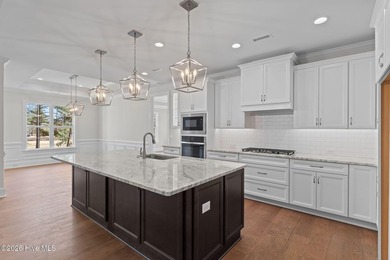 Settle into the ease of coastal living with this thoughtfully on River Landing Golf Course in North Carolina - for sale on GolfHomes.com, golf home, golf lot