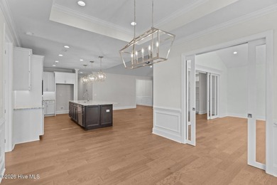 Settle into the ease of coastal living with this thoughtfully on River Landing Golf Course in North Carolina - for sale on GolfHomes.com, golf home, golf lot