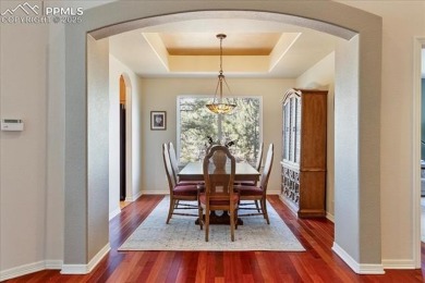 Exquisitely located on the edge of 22 acres of HOA owned forest on The Ridge At Castle Pines North in Colorado - for sale on GolfHomes.com, golf home, golf lot