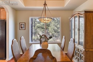 Exquisitely located on the edge of 22 acres of HOA owned forest on The Ridge At Castle Pines North in Colorado - for sale on GolfHomes.com, golf home, golf lot