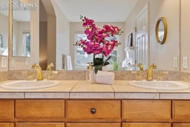 Exquisitely located on the edge of 22 acres of HOA owned forest on The Ridge At Castle Pines North in Colorado - for sale on GolfHomes.com, golf home, golf lot
