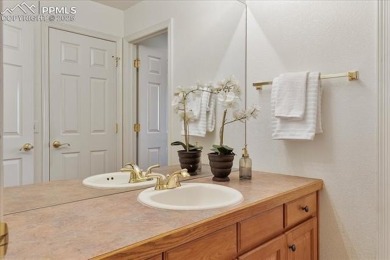 Exquisitely located on the edge of 22 acres of HOA owned forest on The Ridge At Castle Pines North in Colorado - for sale on GolfHomes.com, golf home, golf lot