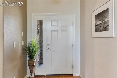 Exquisitely located on the edge of 22 acres of HOA owned forest on The Ridge At Castle Pines North in Colorado - for sale on GolfHomes.com, golf home, golf lot