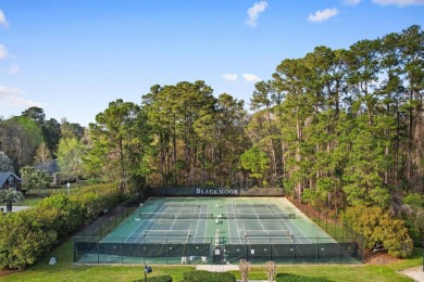 Sip your morning coffee while relaxing on your private screened on Blackmoor Golf Club in South Carolina - for sale on GolfHomes.com, golf home, golf lot