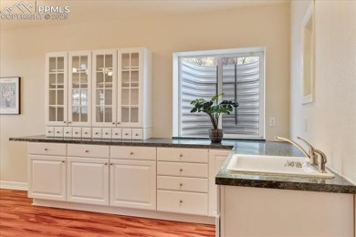 Exquisitely located on the edge of 22 acres of HOA owned forest on The Ridge At Castle Pines North in Colorado - for sale on GolfHomes.com, golf home, golf lot