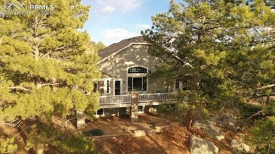 Exquisitely located on the edge of 22 acres of HOA owned forest on The Ridge At Castle Pines North in Colorado - for sale on GolfHomes.com, golf home, golf lot