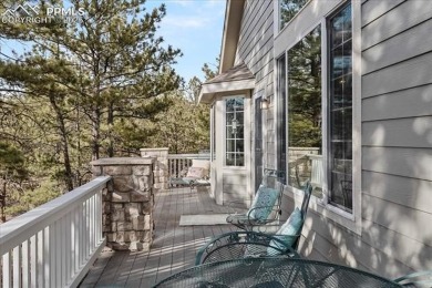Exquisitely located on the edge of 22 acres of HOA owned forest on The Ridge At Castle Pines North in Colorado - for sale on GolfHomes.com, golf home, golf lot