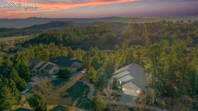 Exquisitely located on the edge of 22 acres of HOA owned forest on The Ridge At Castle Pines North in Colorado - for sale on GolfHomes.com, golf home, golf lot