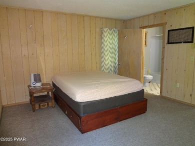 CLASSIC LAKE WALLENPAUPACK PROW FRONT CHALET IN BEAUTIFUL on Paupack Hills Golf and Country Club in Pennsylvania - for sale on GolfHomes.com, golf home, golf lot