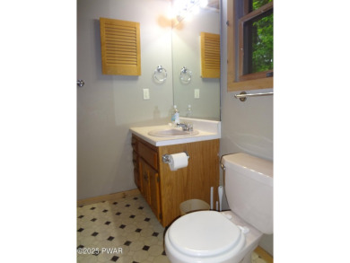 CLASSIC LAKE WALLENPAUPACK PROW FRONT CHALET IN BEAUTIFUL on Paupack Hills Golf and Country Club in Pennsylvania - for sale on GolfHomes.com, golf home, golf lot