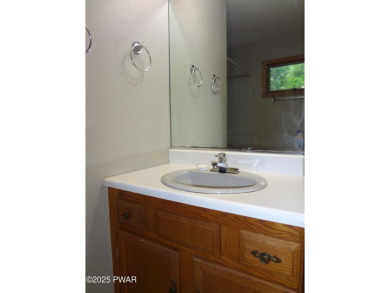 CLASSIC LAKE WALLENPAUPACK PROW FRONT CHALET IN BEAUTIFUL on Paupack Hills Golf and Country Club in Pennsylvania - for sale on GolfHomes.com, golf home, golf lot