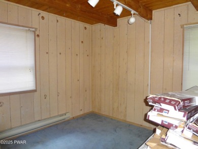 CLASSIC LAKE WALLENPAUPACK PROW FRONT CHALET IN BEAUTIFUL on Paupack Hills Golf and Country Club in Pennsylvania - for sale on GolfHomes.com, golf home, golf lot