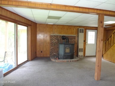 CLASSIC LAKE WALLENPAUPACK PROW FRONT CHALET IN BEAUTIFUL on Paupack Hills Golf and Country Club in Pennsylvania - for sale on GolfHomes.com, golf home, golf lot