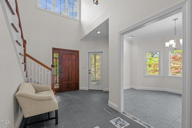 Waterfront living at its finest with this gorgeous 4-bedroom on River Golf and Country Club at Lake Royale in North Carolina - for sale on GolfHomes.com, golf home, golf lot