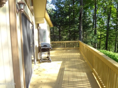 CLASSIC LAKE WALLENPAUPACK PROW FRONT CHALET IN BEAUTIFUL on Paupack Hills Golf and Country Club in Pennsylvania - for sale on GolfHomes.com, golf home, golf lot