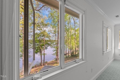 Waterfront living at its finest with this gorgeous 4-bedroom on River Golf and Country Club at Lake Royale in North Carolina - for sale on GolfHomes.com, golf home, golf lot