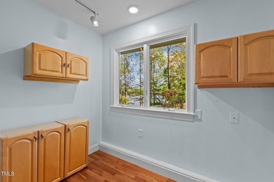 Waterfront living at its finest with this gorgeous 4-bedroom on River Golf and Country Club at Lake Royale in North Carolina - for sale on GolfHomes.com, golf home, golf lot