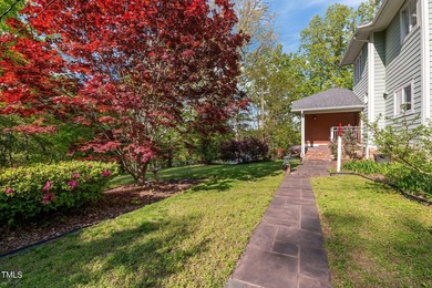 Waterfront living at its finest with this gorgeous 4-bedroom on River Golf and Country Club at Lake Royale in North Carolina - for sale on GolfHomes.com, golf home, golf lot