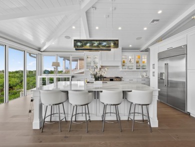 View, view, view! Experience modern luxury in this ''renovated on Hideaway Beach Golf Course in Florida - for sale on GolfHomes.com, golf home, golf lot