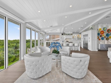 View, view, view! Experience modern luxury in this ''renovated on Hideaway Beach Golf Course in Florida - for sale on GolfHomes.com, golf home, golf lot