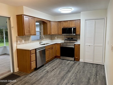 Adorable Concrete Block 3 Bedroom 2 bathroom home tucked away in on  in Florida - for sale on GolfHomes.com, golf home, golf lot