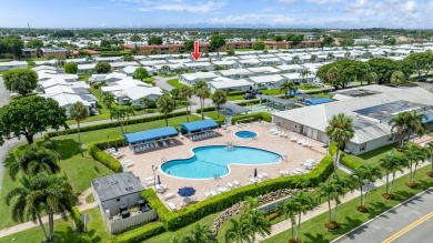 Welcome to Palm Beach Leisureville, a 55+ community! This large on Leisureville Community Golf Course in Florida - for sale on GolfHomes.com, golf home, golf lot