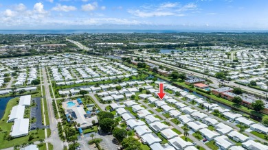 Welcome to Palm Beach Leisureville, a 55+ community! This large on Leisureville Community Golf Course in Florida - for sale on GolfHomes.com, golf home, golf lot