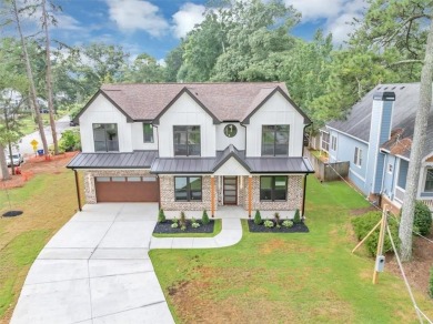 Step into flawless modern luxury at this brand-new custom-built on East Lake Golf Club in Georgia - for sale on GolfHomes.com, golf home, golf lot