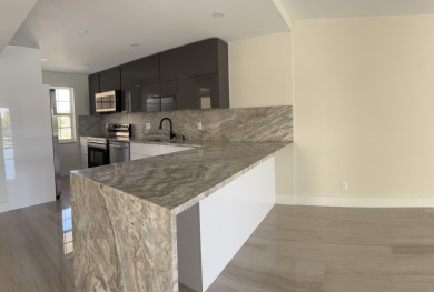 Fully remodeled corner 3BR/2BA condo bathed in natural light on Palm-Aire Country Club and Resort - The Oaks in Florida - for sale on GolfHomes.com, golf home, golf lot