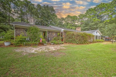 Charming All-Brick Home with NO HOA and a HUGE LOT. This on The Founders Club At Pawleys Island in South Carolina - for sale on GolfHomes.com, golf home, golf lot