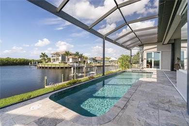 EXCEPTIONAL TWO-STORY HOME IN BSI W/FANTASTIC CANAL BASIN VIEW & on Twin Isles Country Club in Florida - for sale on GolfHomes.com, golf home, golf lot