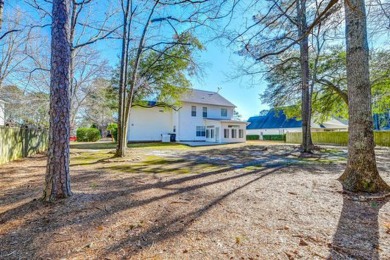 Discover the epitome of Lowcountry living in this elegant on Crowfield Golf and Country Club in South Carolina - for sale on GolfHomes.com, golf home, golf lot