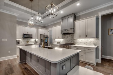 This stunning home, built in 2020 by a local custom builder on Myrtlewood Golf Course and Club  in South Carolina - for sale on GolfHomes.com, golf home, golf lot