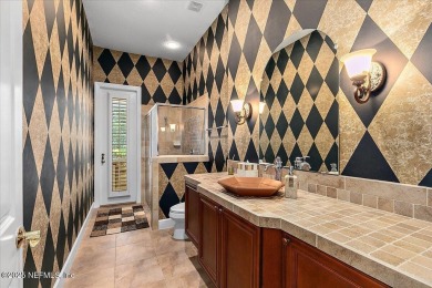 BEAUTIFUL ARTHUR RUTENBERG CONCRETE BLOCK CONSTRUCTED HOME. THIS on Queens Harbour Yacht and Country Club in Florida - for sale on GolfHomes.com, golf home, golf lot