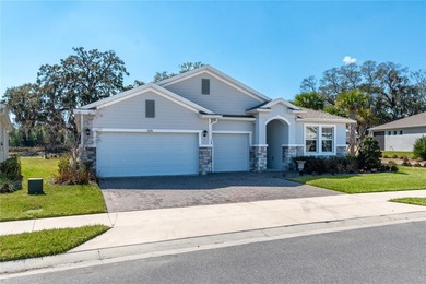 Built in 2023, this eye-catching home has plenty of curb appeal on Trilogy at Ocala Preserve in Florida - for sale on GolfHomes.com, golf home, golf lot