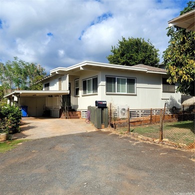 Charming 3-bedroom, 1.5-bath home in a prime Kapahulu location on Ala Wai Golf Course in Hawaii - for sale on GolfHomes.com, golf home, golf lot