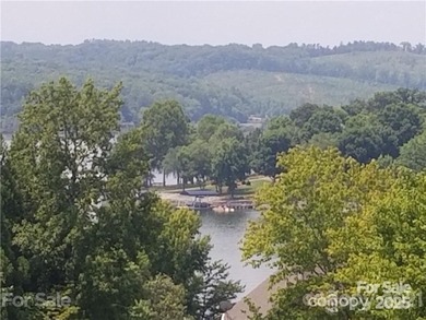 This premium Badin Lake water view lot is located in the on Old North State Club at Uwharrie Point Golf community in North Carolina - for sale on GolfHomes.com, golf home, golf lot