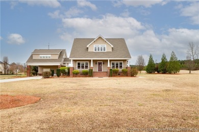 This craftsman-style home, is situated along the greens of on TimberLake Golf Club in North Carolina - for sale on GolfHomes.com, golf home, golf lot