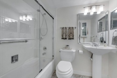 SPECTACULAR CONDO WITH AMAZING WATER VIEW FROM THE 4TH FLOOR on Hillsboro Pines Golf in Florida - for sale on GolfHomes.com, golf home, golf lot